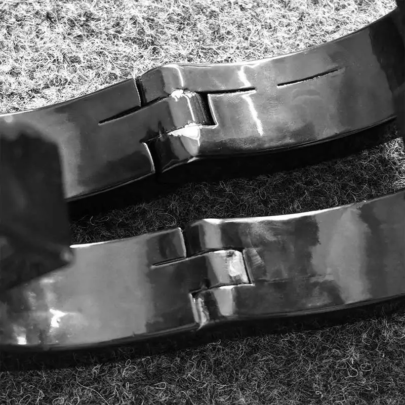 scape-proof locking lugs on professional-grade steel restraints, handcrafted by Fetish Workshop.